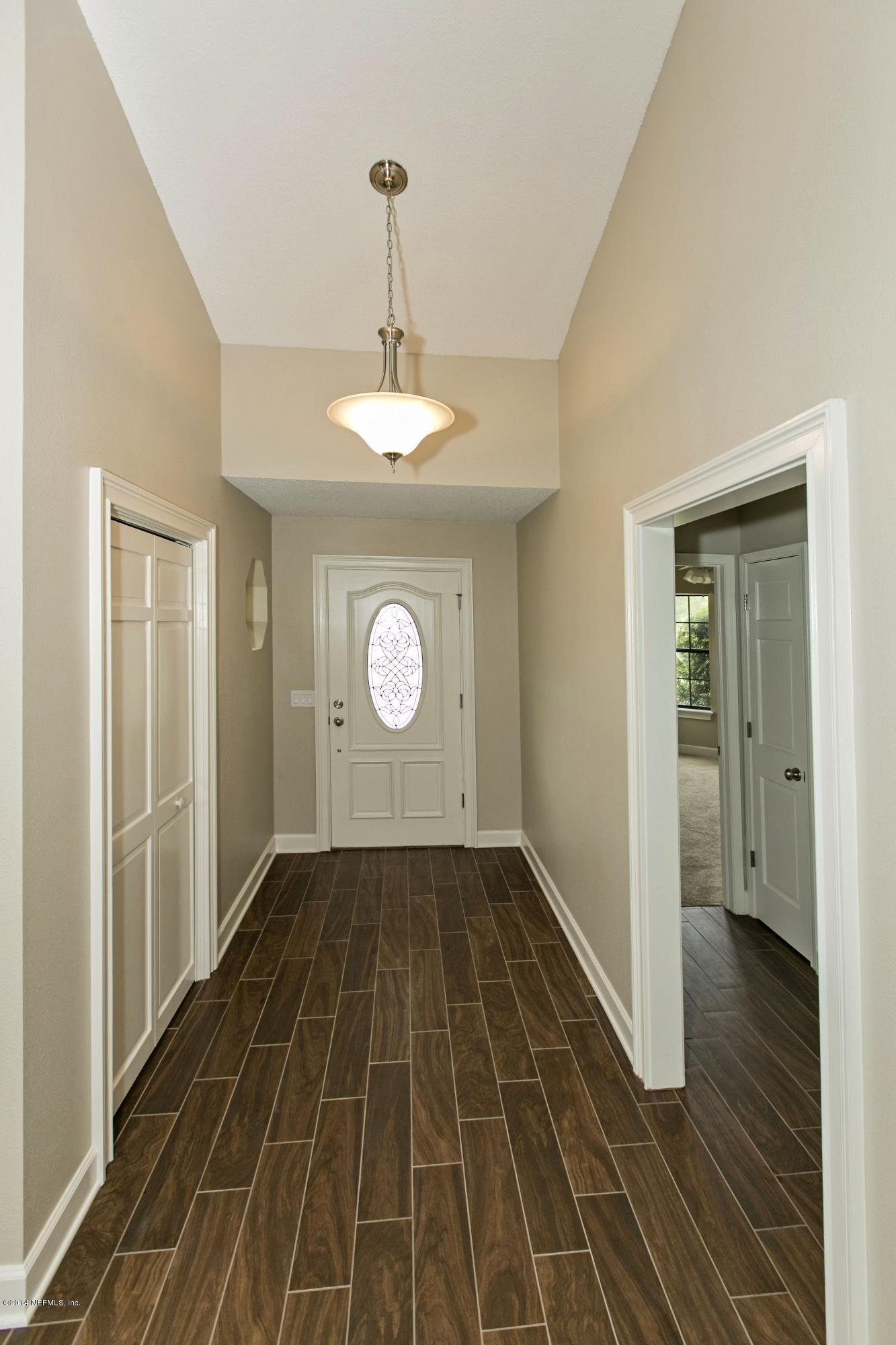 5395 D Church Road St. Augustine, FL 32092 - Photo 27 of 27 a view of a livingroom with wooden floor and a window