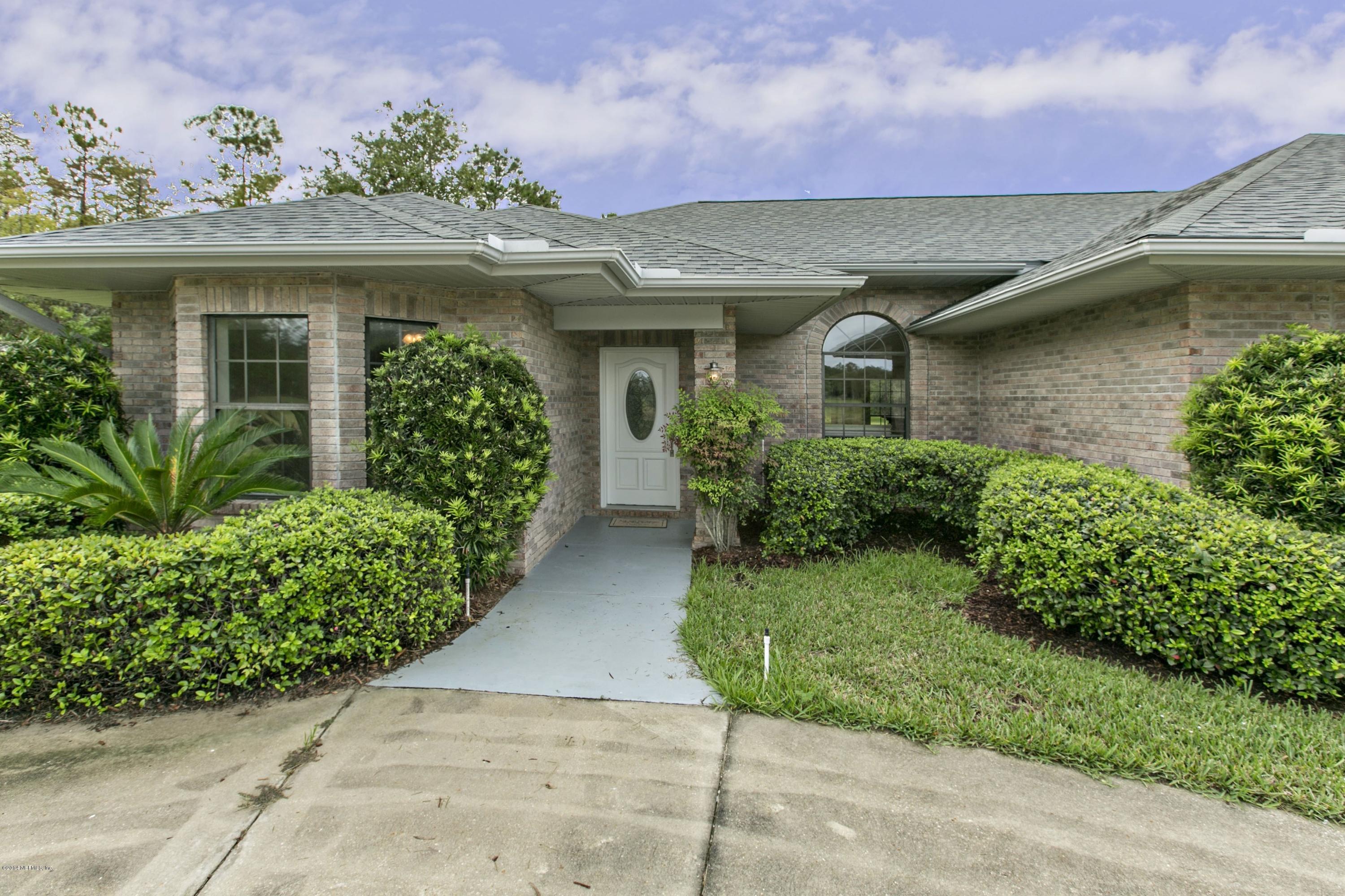 5395 D Church Road St. Augustine, FL 32092 - Photo 3 of 27 a front view of a house with garden