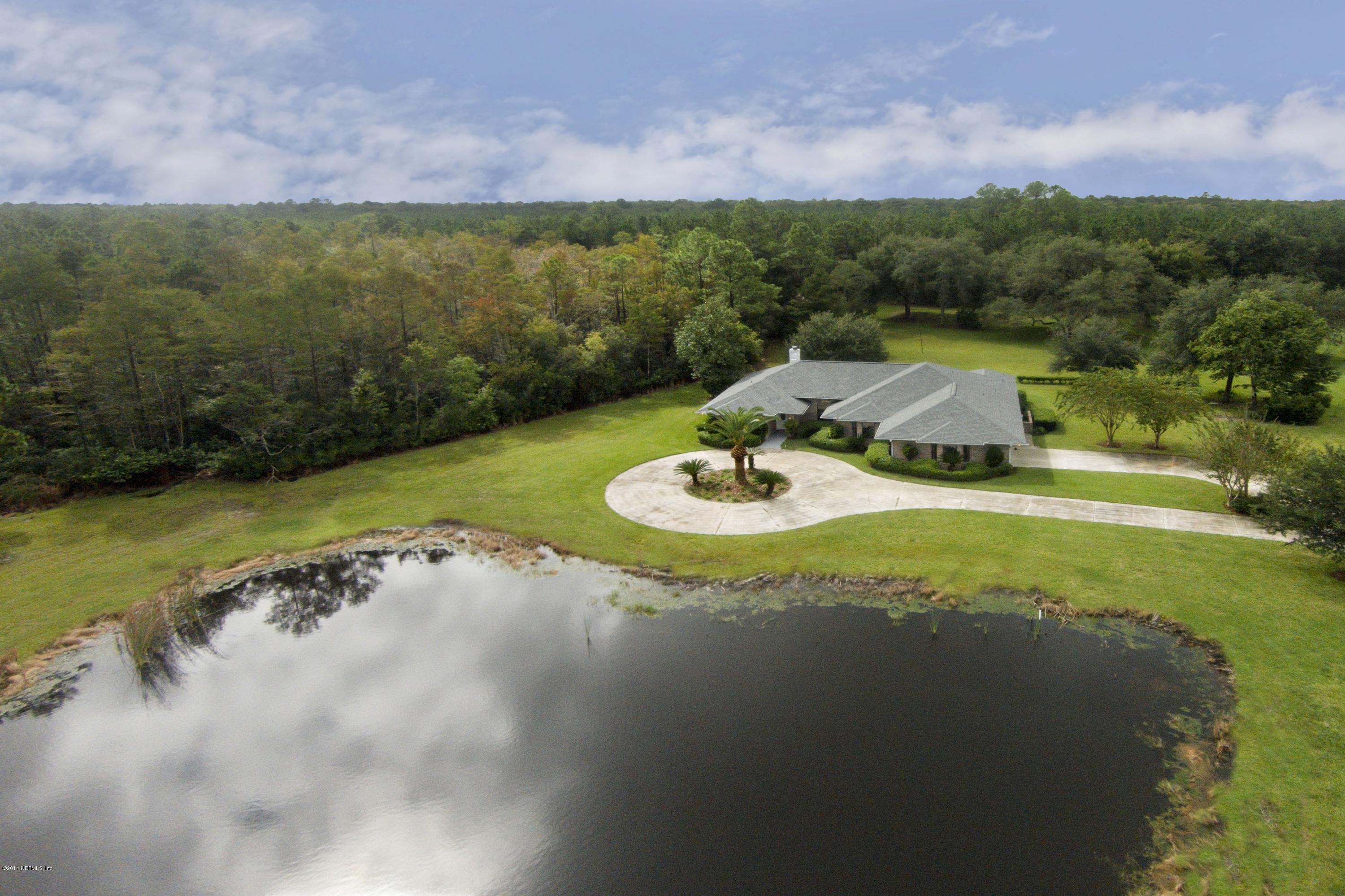 5395 D Church Road St. Augustine, FL 32092 - Photo 4 of 27 a view of a lake with a yard