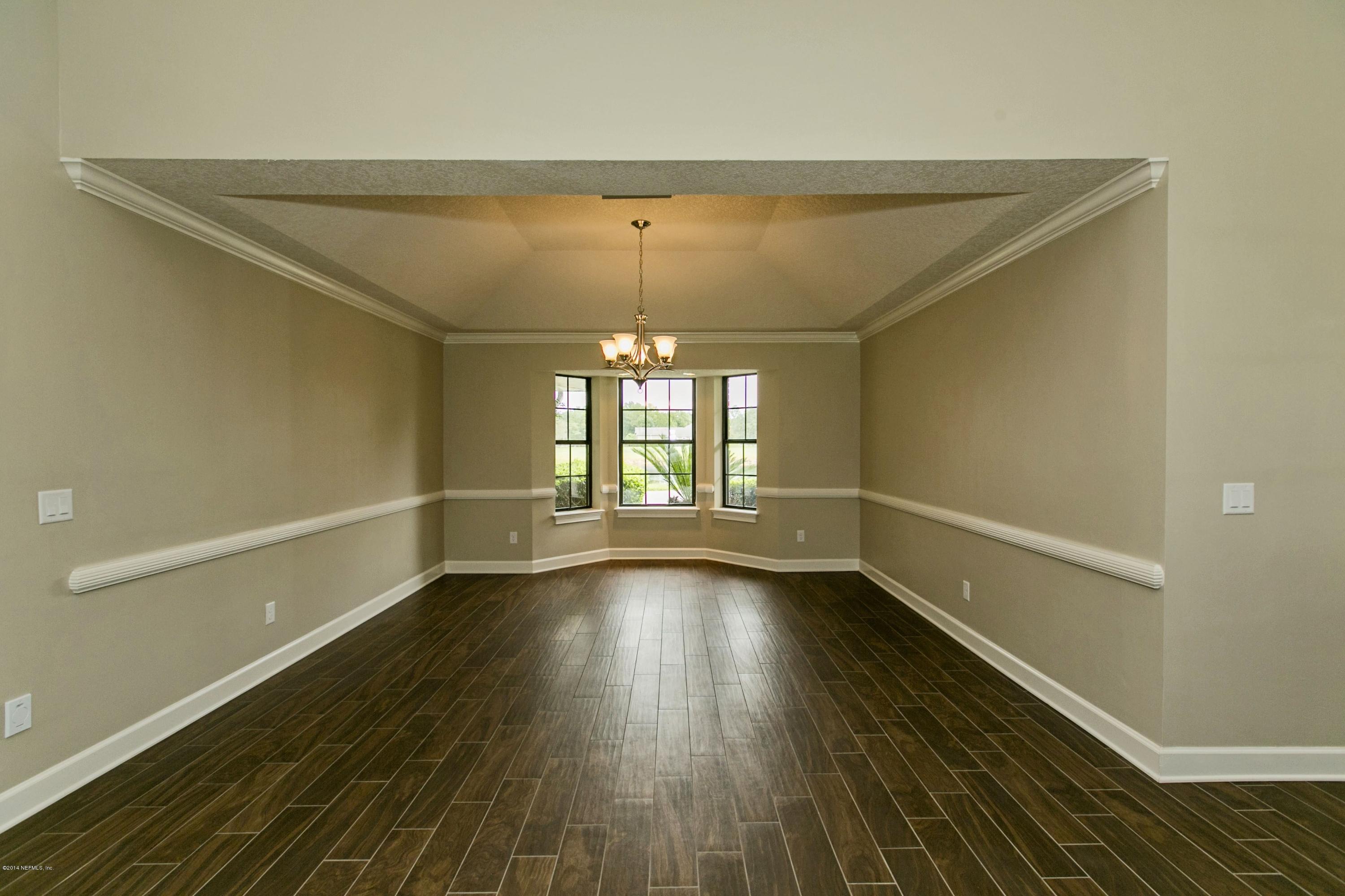 5395 D Church Road St. Augustine, FL 32092 - Photo 8 of 27 wooden floor in an empty room with a window