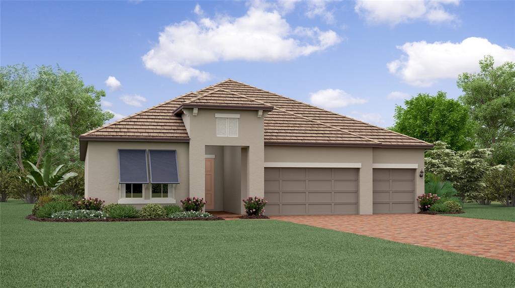 a front view of a house with a garden and yard