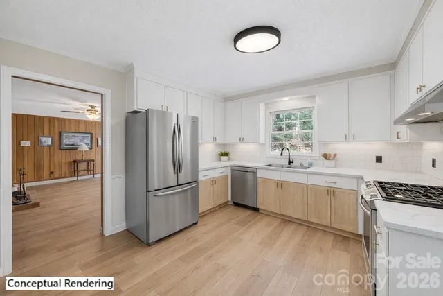 a kitchen with a refrigerator cabinets and wooden floor