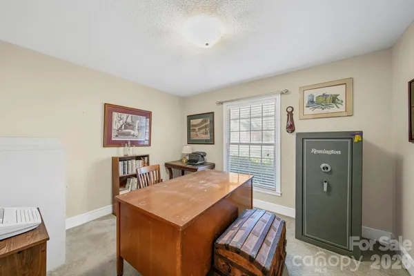 a view of a livingroom with furniture and window