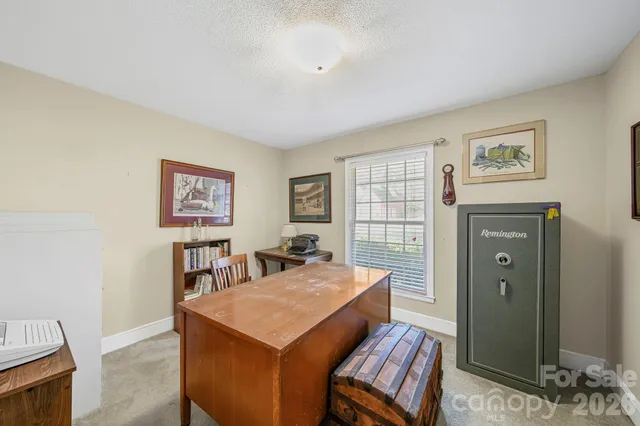 a view of a livingroom with furniture and window