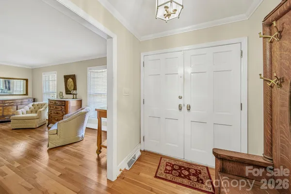 a view of a livingroom with furniture and hardwood floor