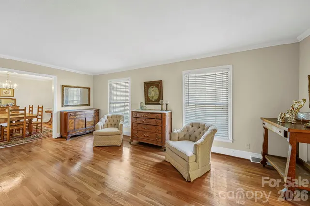 a living room with furniture window and wooden floor