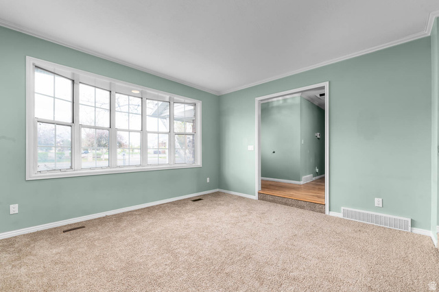 1822 East 9800th Street South Sandy, UT 84092 - Photo 26 of 38 Unfurnished bedroom featuring carpet and crown molding