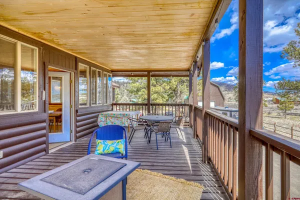 a view of backyard with cabin