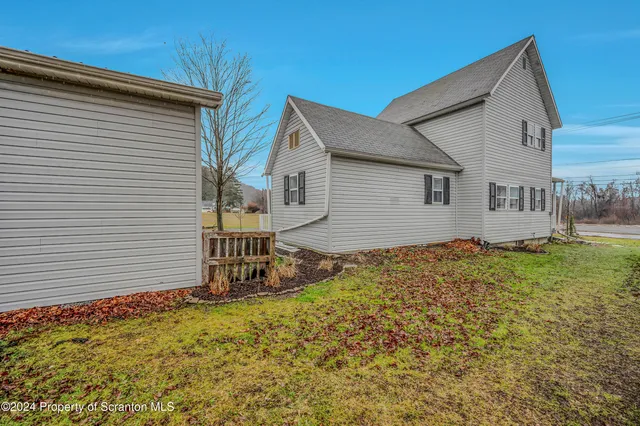 a house view with a backyard space
