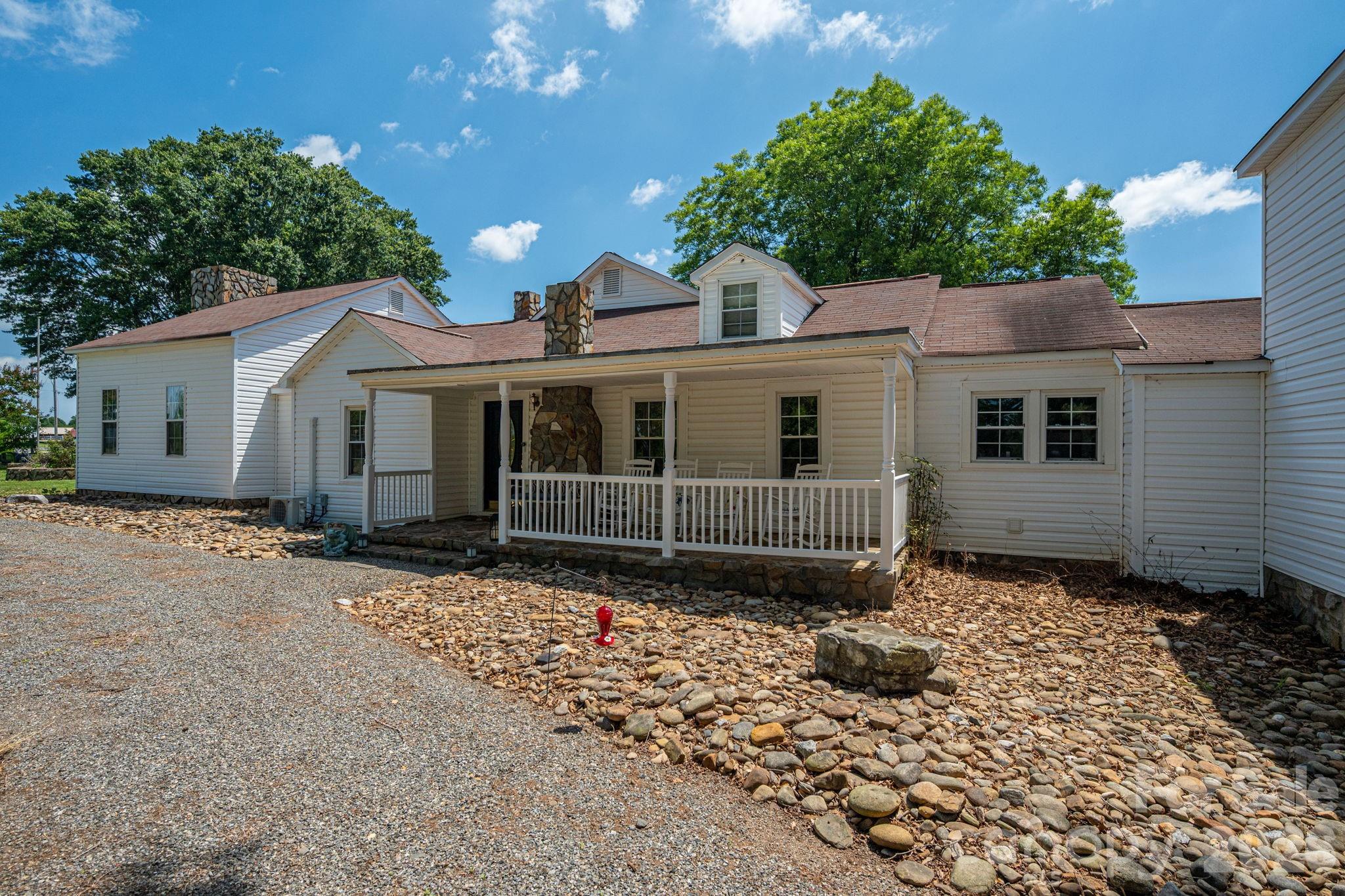 1387 George Brown Road Crouse, NC 28033 - Photo 7 of 48 a view of a house with a small yard and a large tree