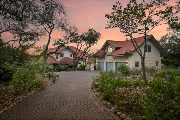 a house with trees in the background