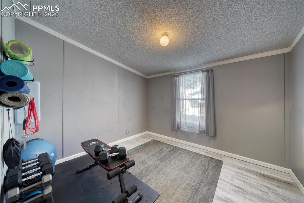 36 Valley Circle Guffey, CO 80820 - Photo 11 of 29 a room with gym equipment and a window