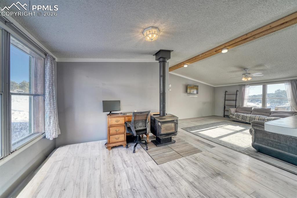 36 Valley Circle Guffey, CO 80820 - Photo 14 of 29 a bedroom with furniture and a wooden floor