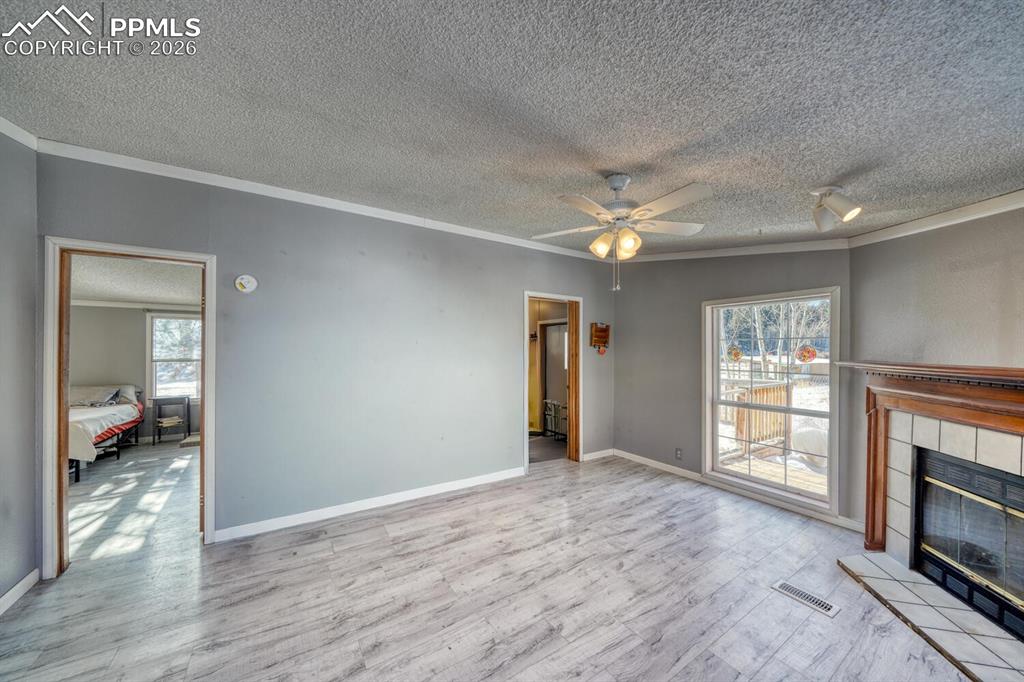 36 Valley Circle Guffey, CO 80820 - Photo 15 of 29 a view of an empty room with window and wooden floor
