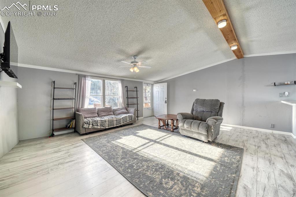 36 Valley Circle Guffey, CO 80820 - Photo 6 of 29 a living room with furniture and a flat screen tv