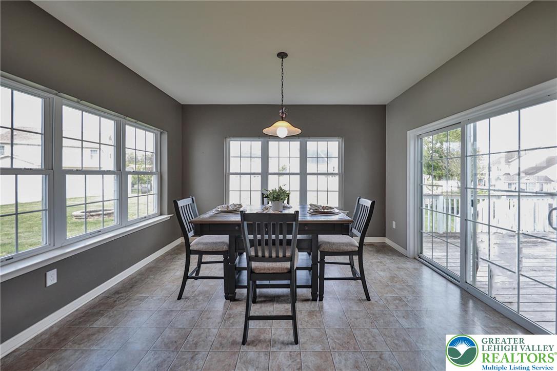 2702 Monacacy Road Nazareth, PA 18064 - Photo 24 of 68 sliding glass doors lead to the deck with stairs to the back yard.