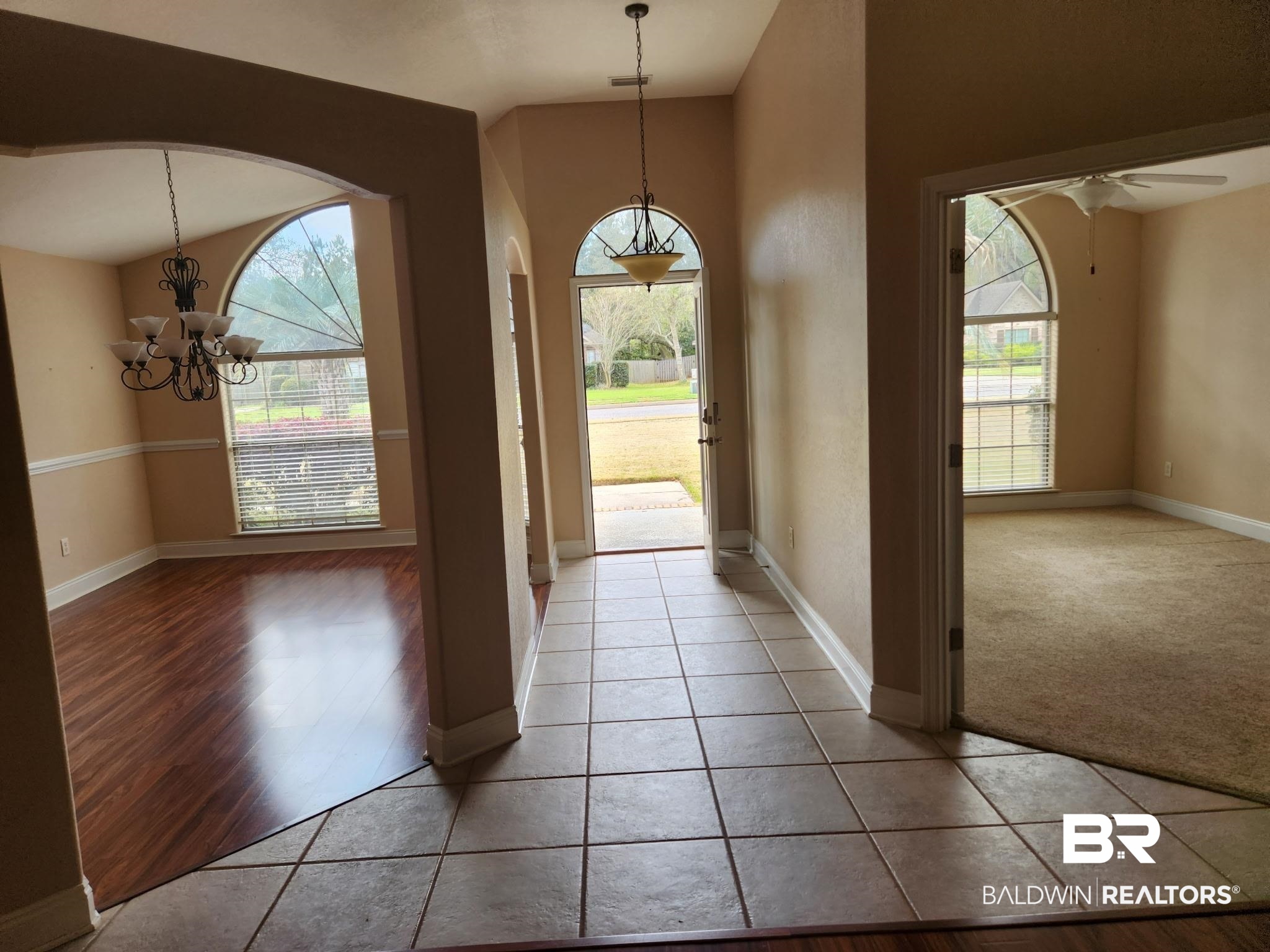 9425 Autauga Bend Daphne, AL 36526 - Photo 4 of 15 Foyer featuring a chandelier, healthy amount of natural light, light tile patterned floors, and ceiling fan