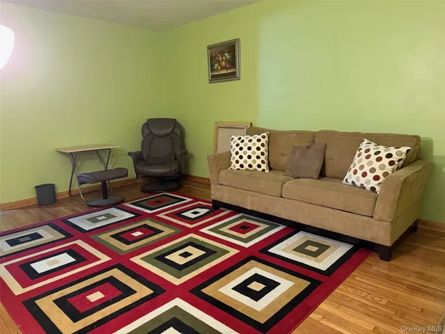 a living room with furniture and a rug