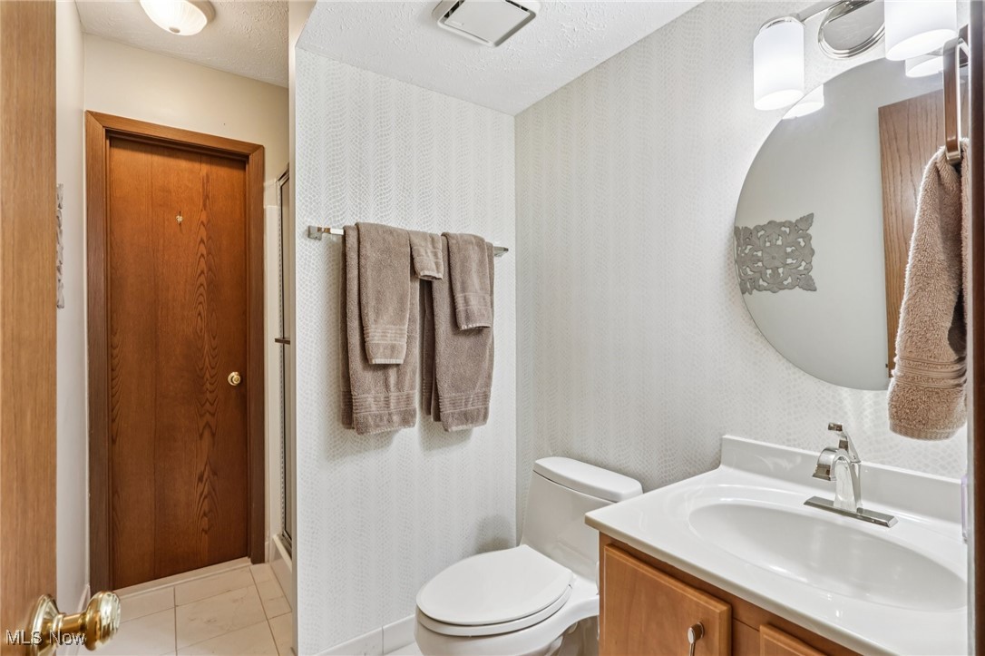 235 Solon Road, Unit D Chagrin Falls, OH 44022 - Photo 15 of 37 Full bathroom with vanity and shower