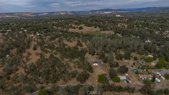 an aerial view of residential house and green space