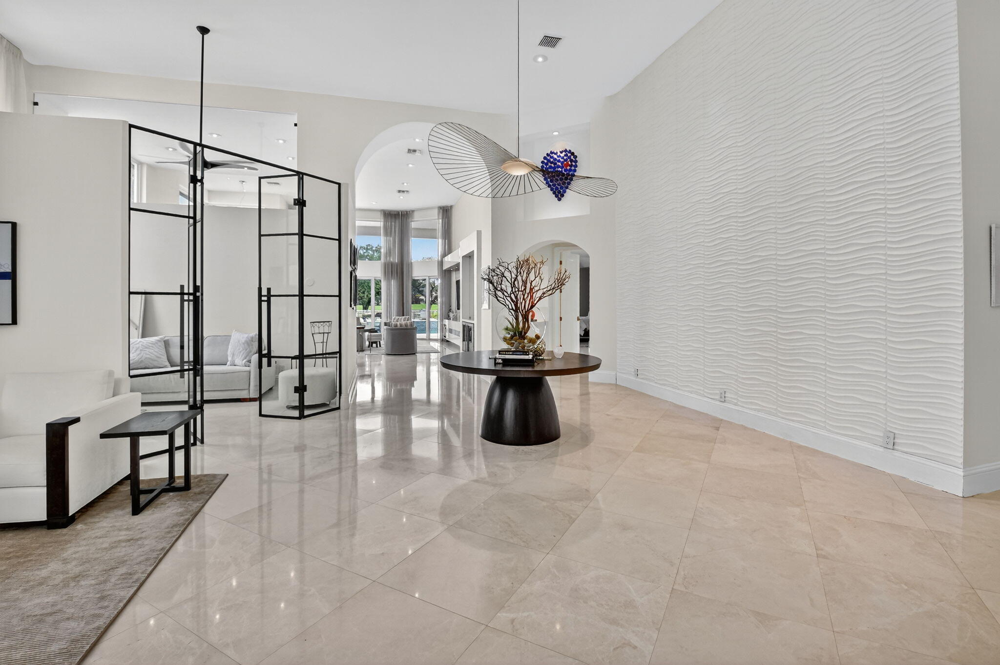 2563 Northwest 63rd Street Boca Raton, FL 33496 - Photo 9 of 65 a view of a room with lots of stuff and hardwood floor