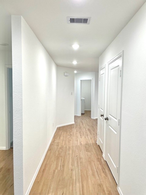 18646 Gravago Lane New Caney, TX 77357 - Photo 3 of 21 a view of a hallway with wooden floor