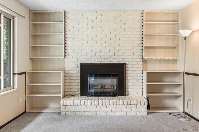a room with a fireplace and a walk in closet