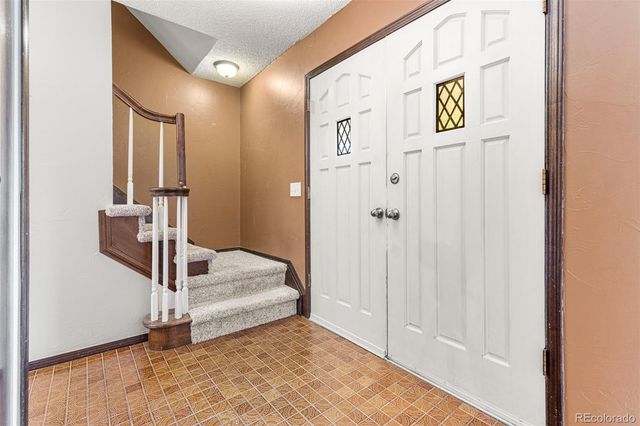 a view of front door and bedroom