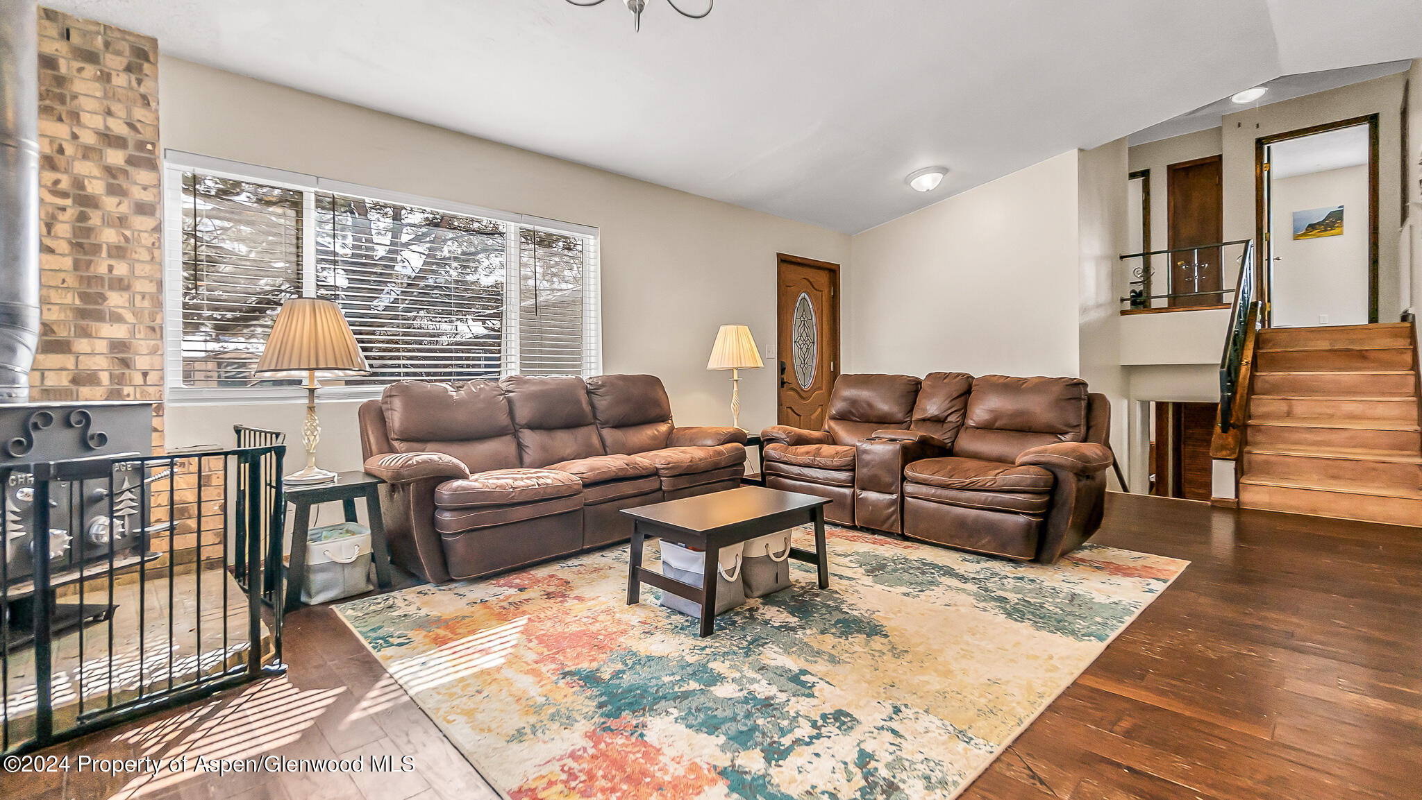 1014 West 5th Street Rifle, CO 81650 - Photo 5 of 38 a living room with furniture and a window