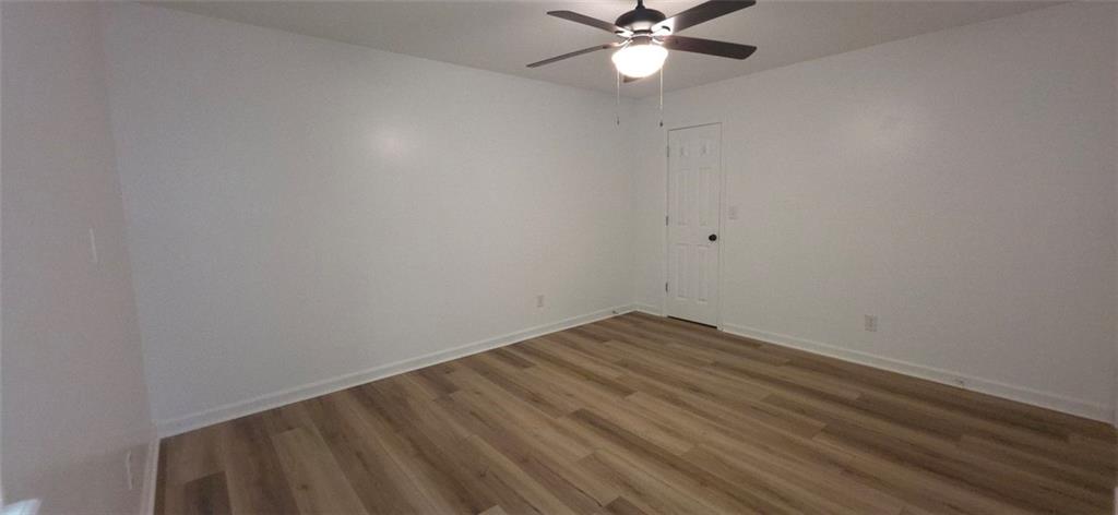 1774 Joe Black Road Sautee Nacoochee, GA 30571 - Photo 8 of 20 a view of a room with wooden floor and a chandelier fan