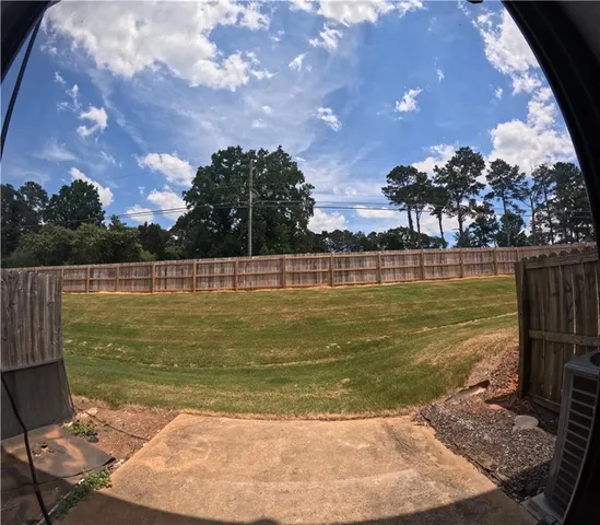 a view of a water fountain and a yard