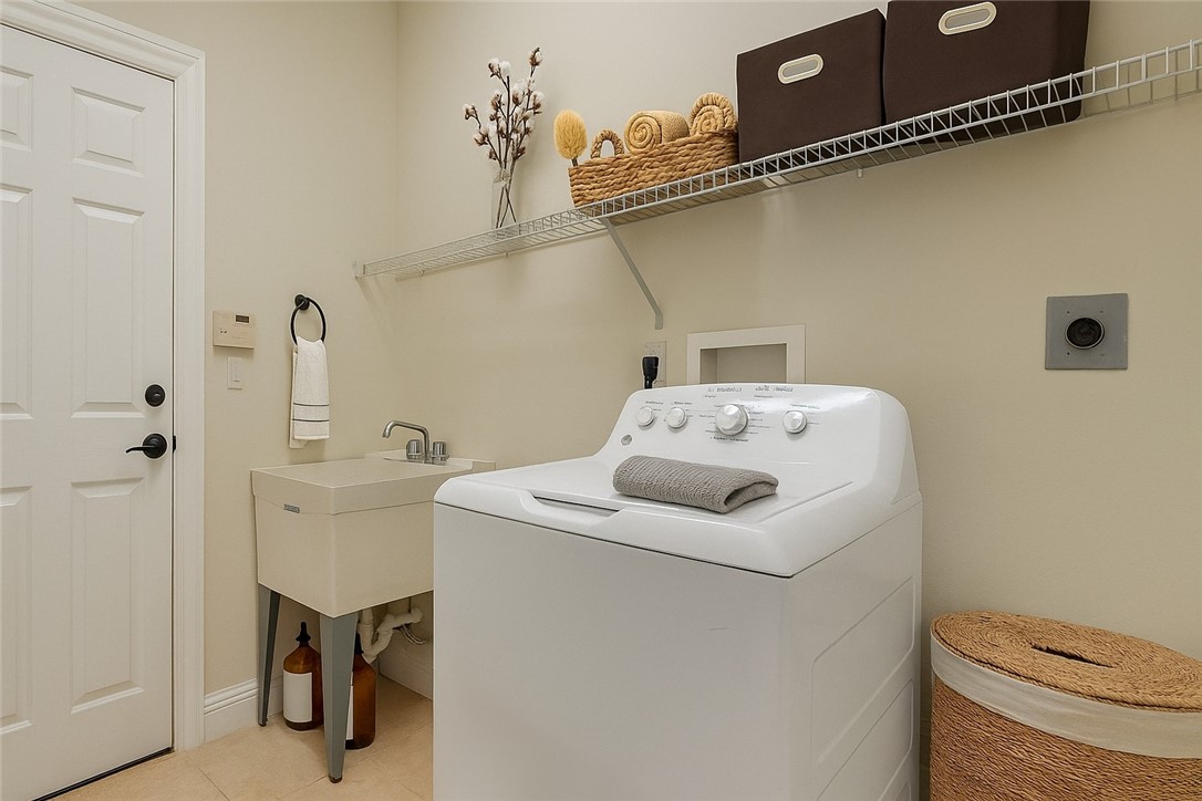 1923 Grey Falcon Circle Southwest Vero Beach, FL 32962 - Photo 22 of 36 a utility room with dryer and washer