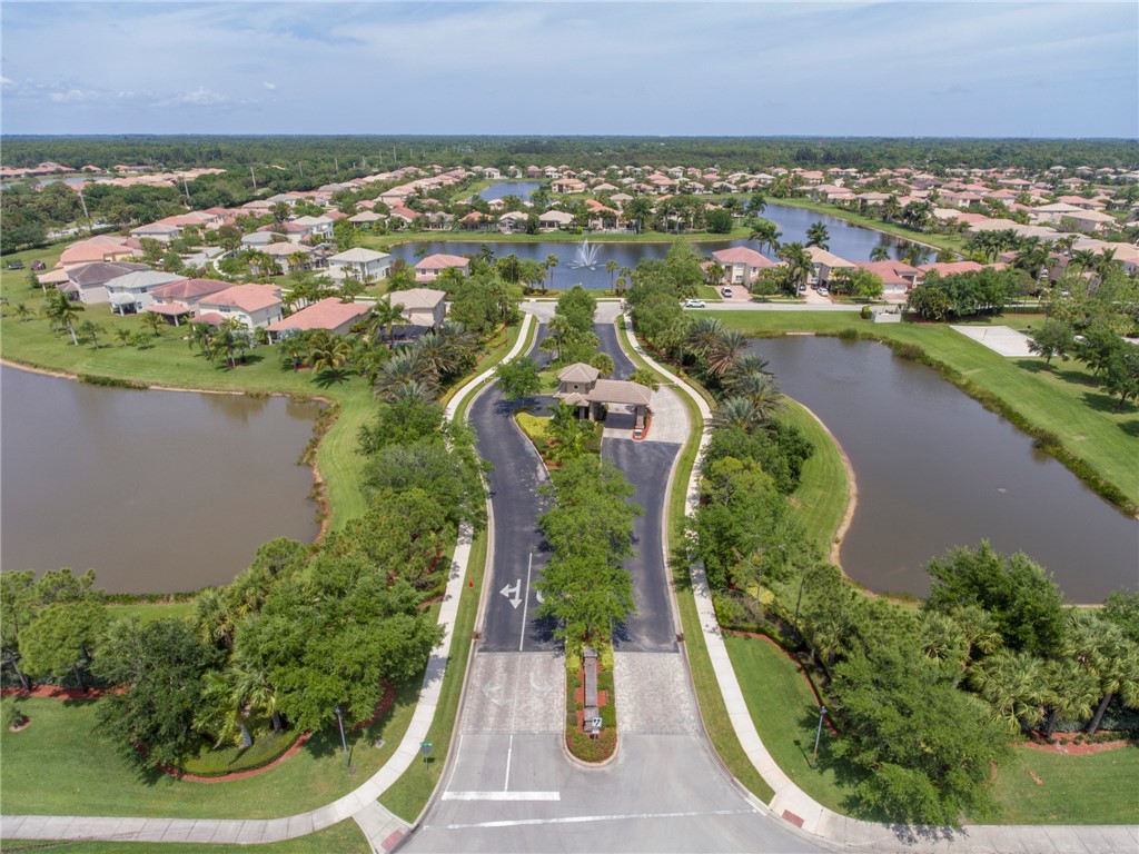 1923 Grey Falcon Circle Southwest Vero Beach, FL 32962 - Photo 27 of 36 an aerial view of residential houses with outdoor space and lake view