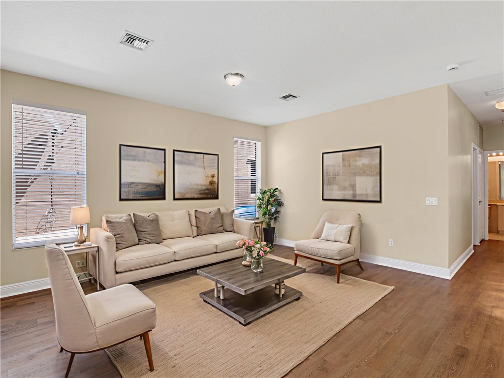 1923 Grey Falcon Circle Southwest Vero Beach, FL 32962 - Photo 9 of 36 a living room with furniture rug and window