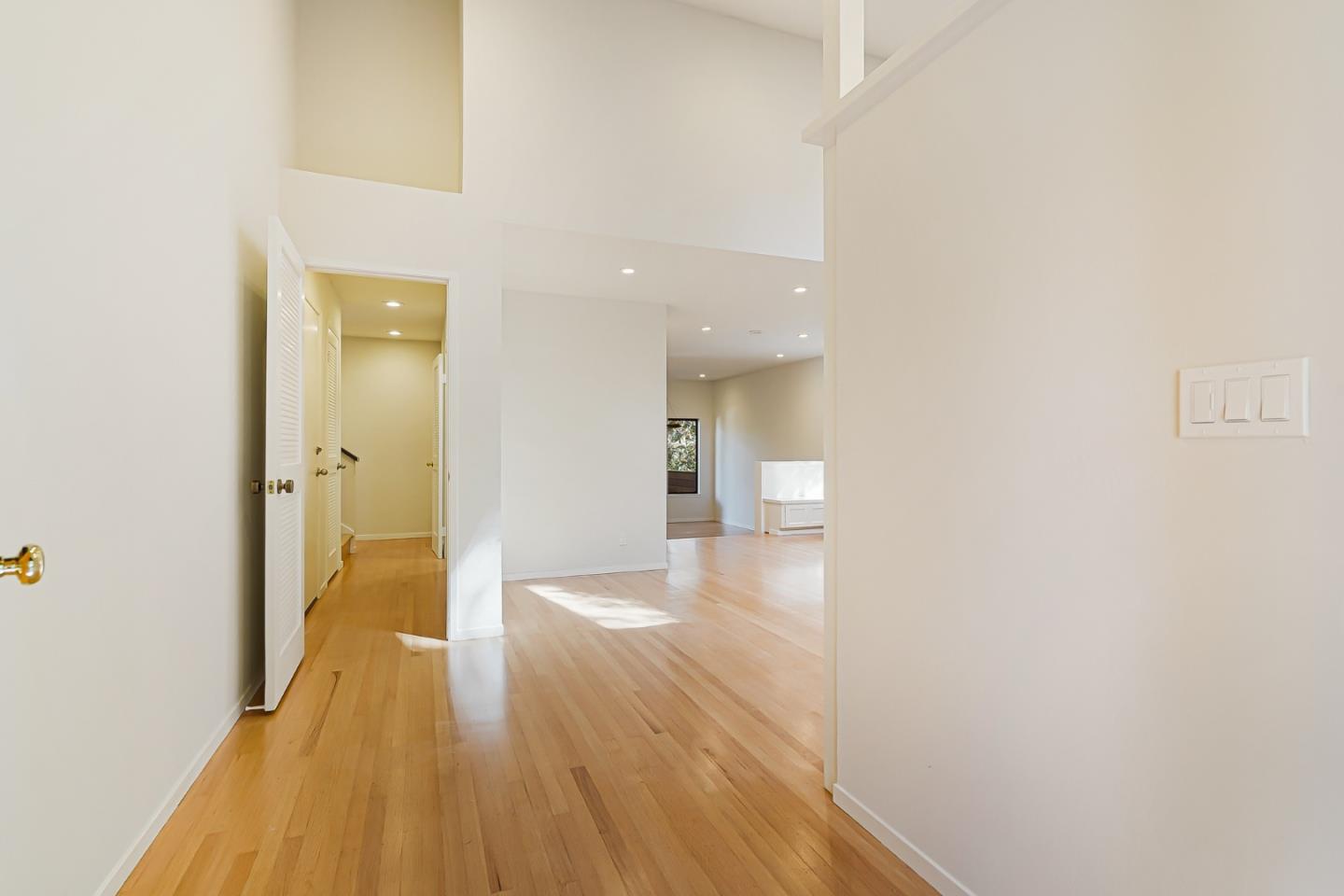 2499 Alpine Road Menlo Park, CA 94025 - Photo 3 of 53 a view of a hallway with wooden floor and a bathroom