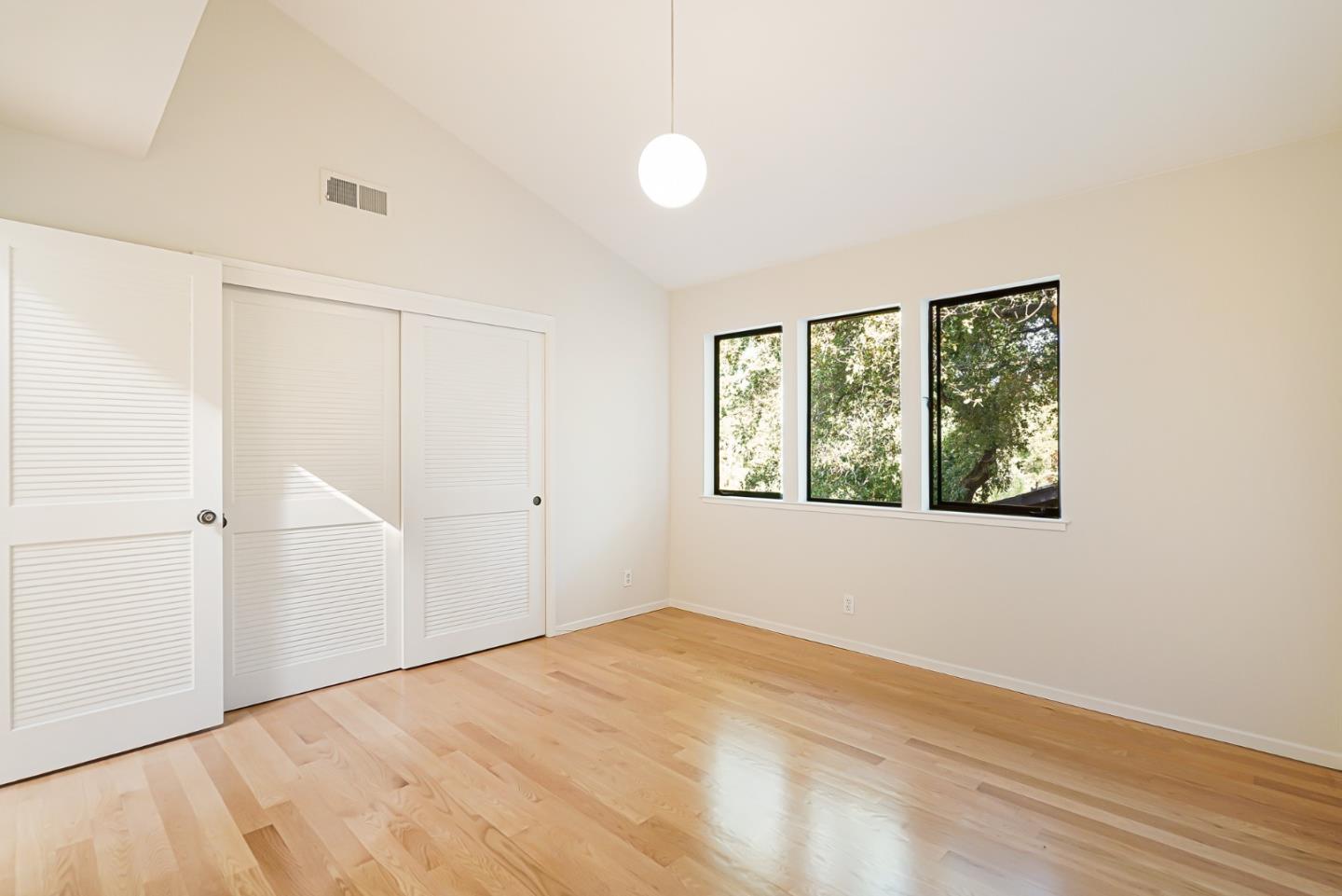 2499 Alpine Road Menlo Park, CA 94025 - Photo 36 of 53 a view of an empty room with wooden floor and a window