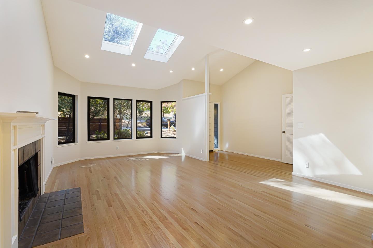 2499 Alpine Road Menlo Park, CA 94025 - Photo 5 of 53 a view of an empty room with wooden floor and a fireplace