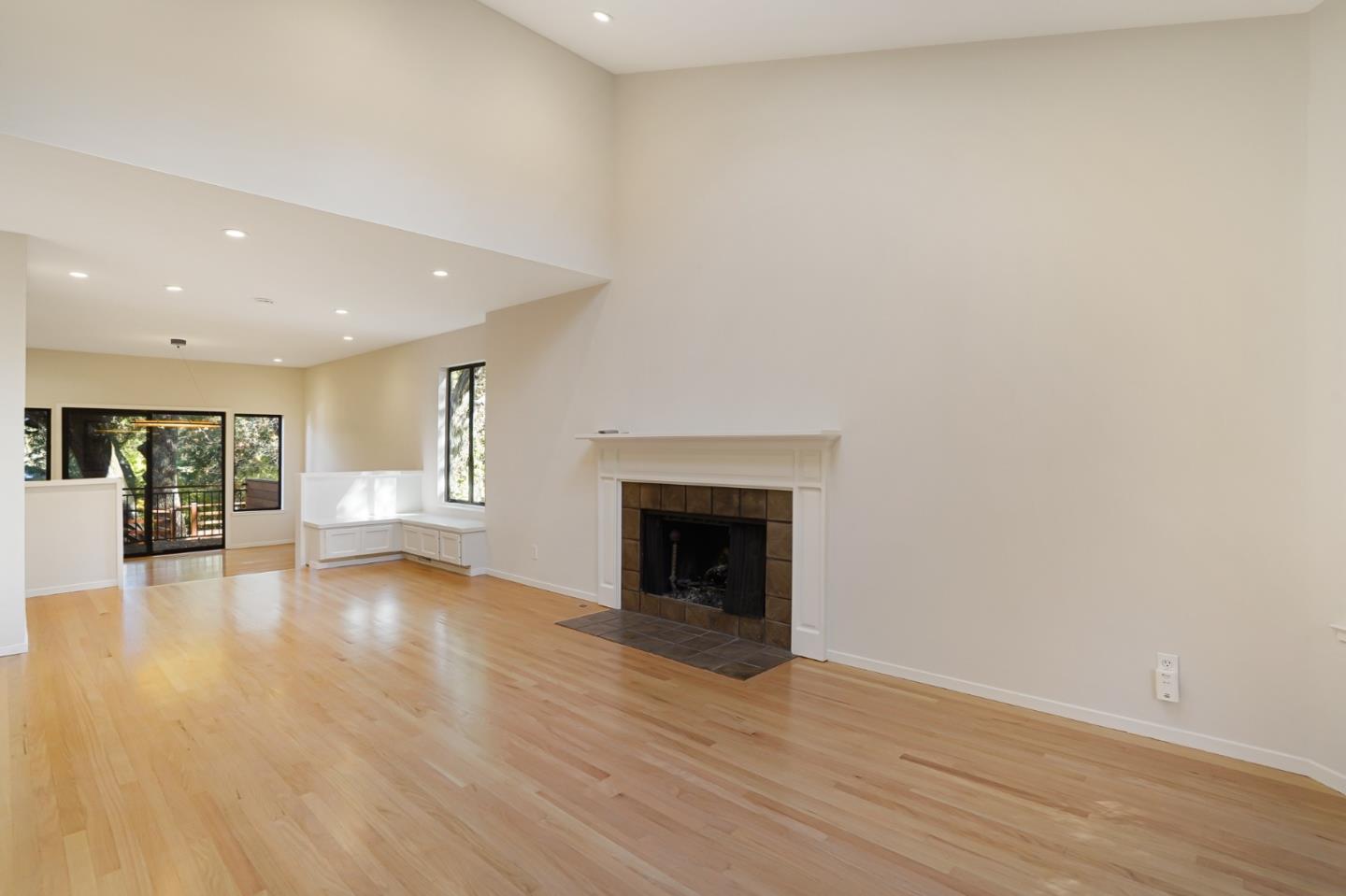 2499 Alpine Road Menlo Park, CA 94025 - Photo 7 of 53 a view of an empty room with wooden floor and a fireplace