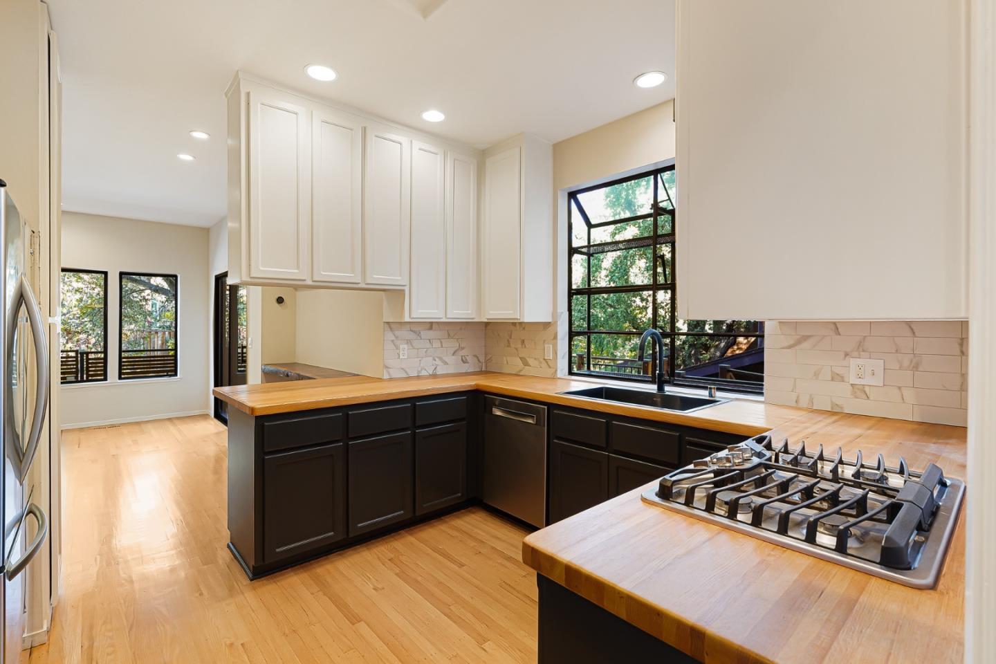 2499 Alpine Road Menlo Park, CA 94025 - Photo 10 of 53 a kitchen with stainless steel appliances kitchen island granite countertop a stove and a sink