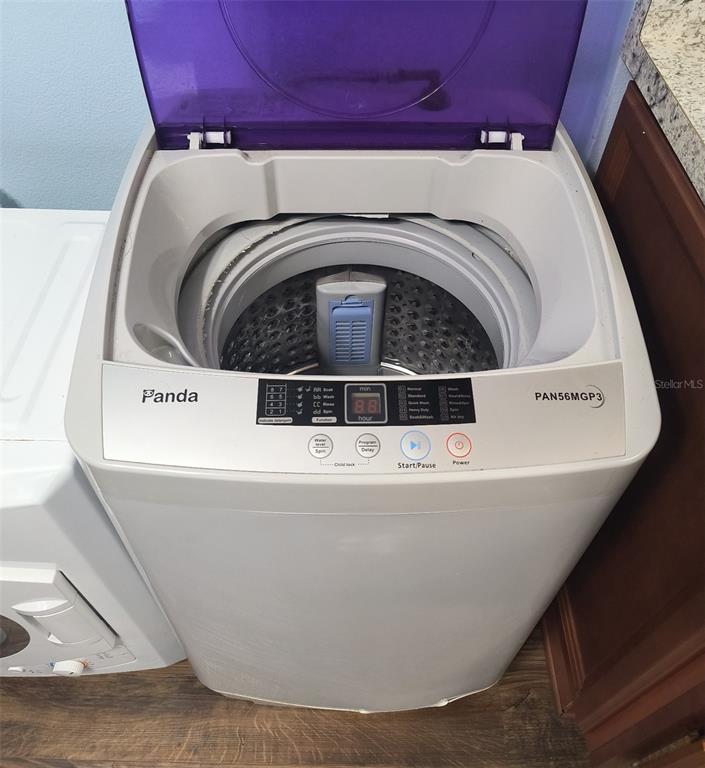 6519 West Newberry Road, Unit 1006 Gainesville, FL 32605 - Photo 11 of 31 a utility room with a washer and dryer