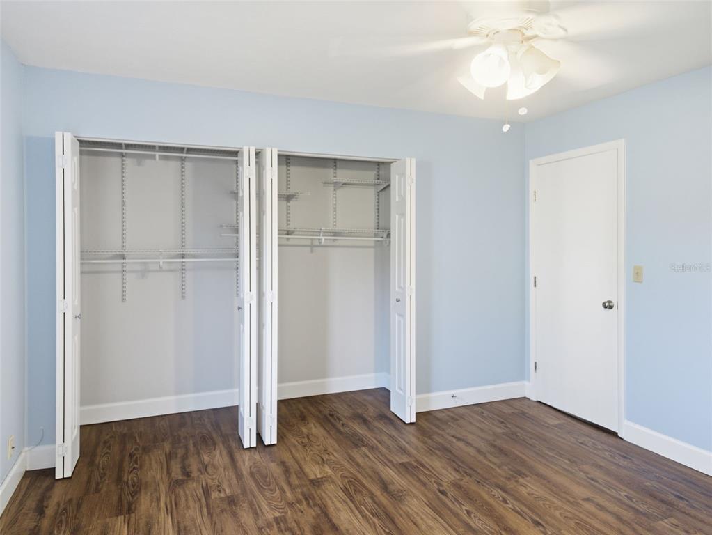 6519 West Newberry Road, Unit 1006 Gainesville, FL 32605 - Photo 16 of 31 wooden floor in an empty room with a window