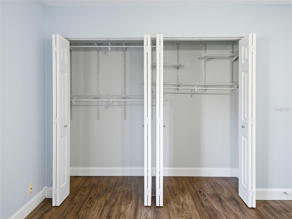 6519 West Newberry Road, Unit 1006 Gainesville, FL 32605 - Photo 17 of 31 a view of an empty room with wooden floor