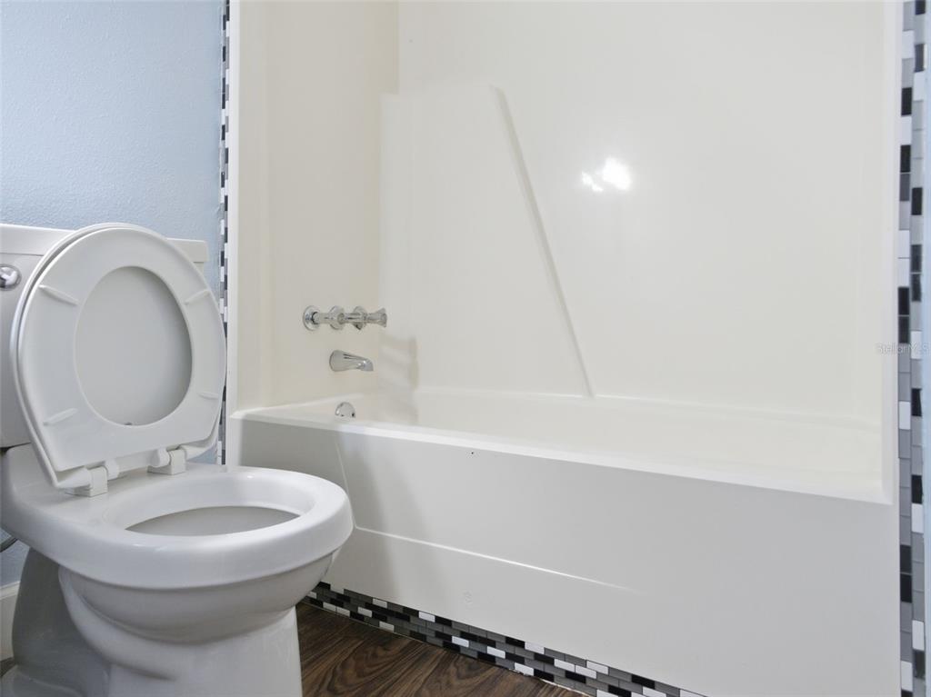 6519 West Newberry Road, Unit 1006 Gainesville, FL 32605 - Photo 22 of 31 a bathroom with a sink and a mirror