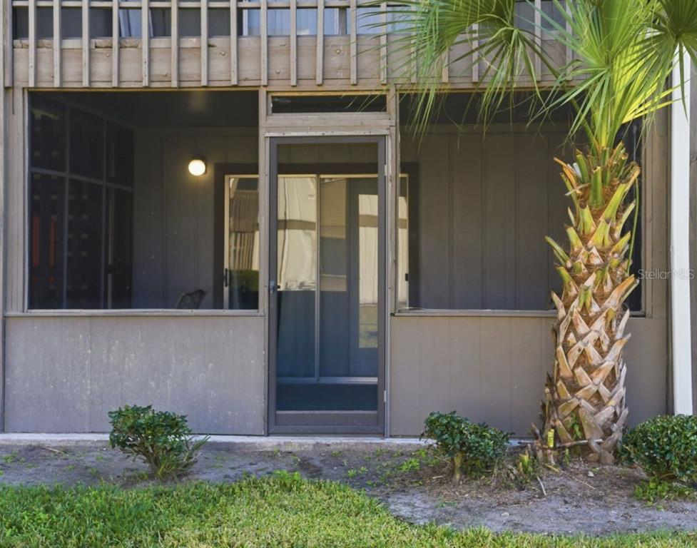 6519 West Newberry Road, Unit 1006 Gainesville, FL 32605 - Photo 28 of 31 a couple of potted plants in front of door