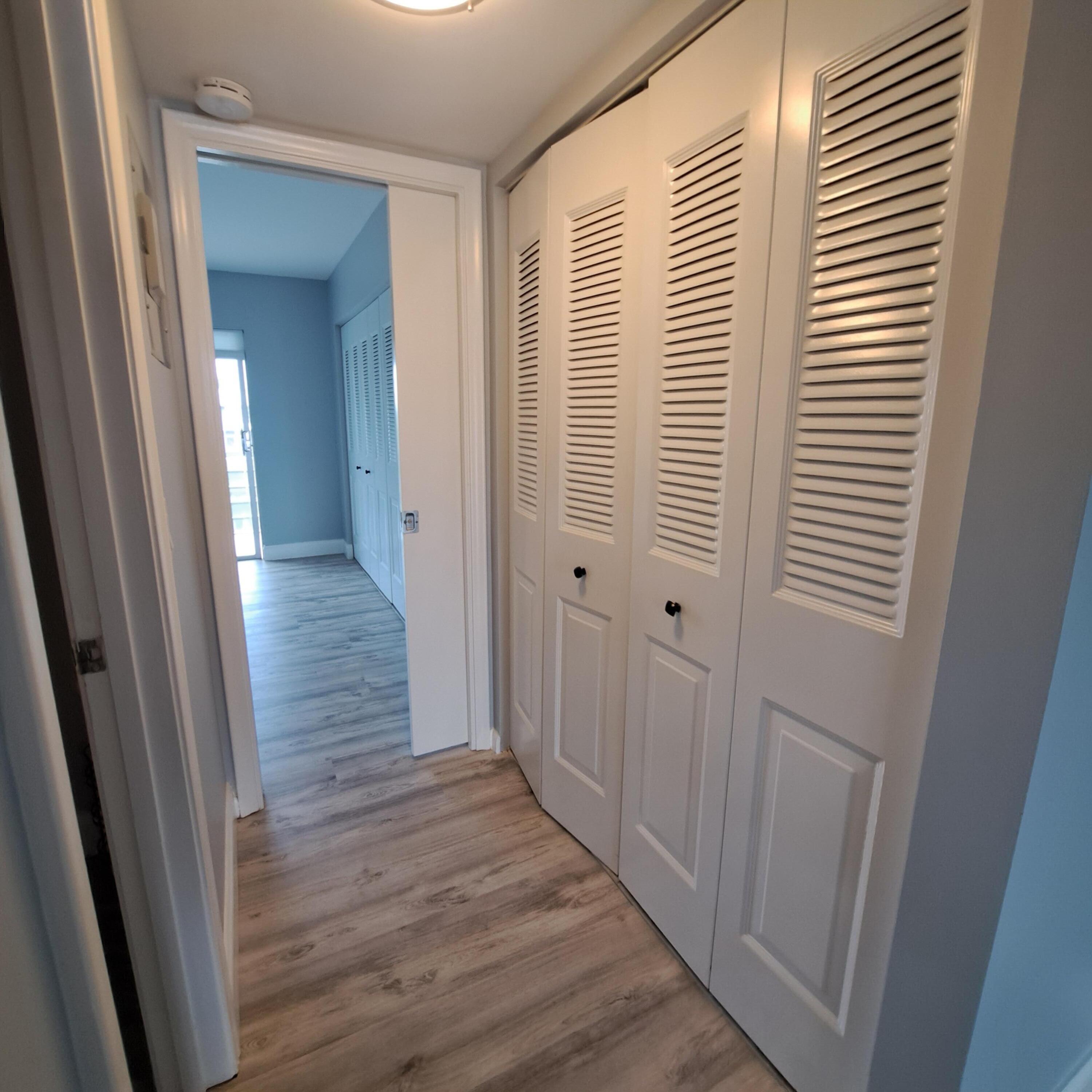 55 Northampton C West Palm Beach, FL 33417 - Photo 7 of 14 a view of a hallway with wooden floor