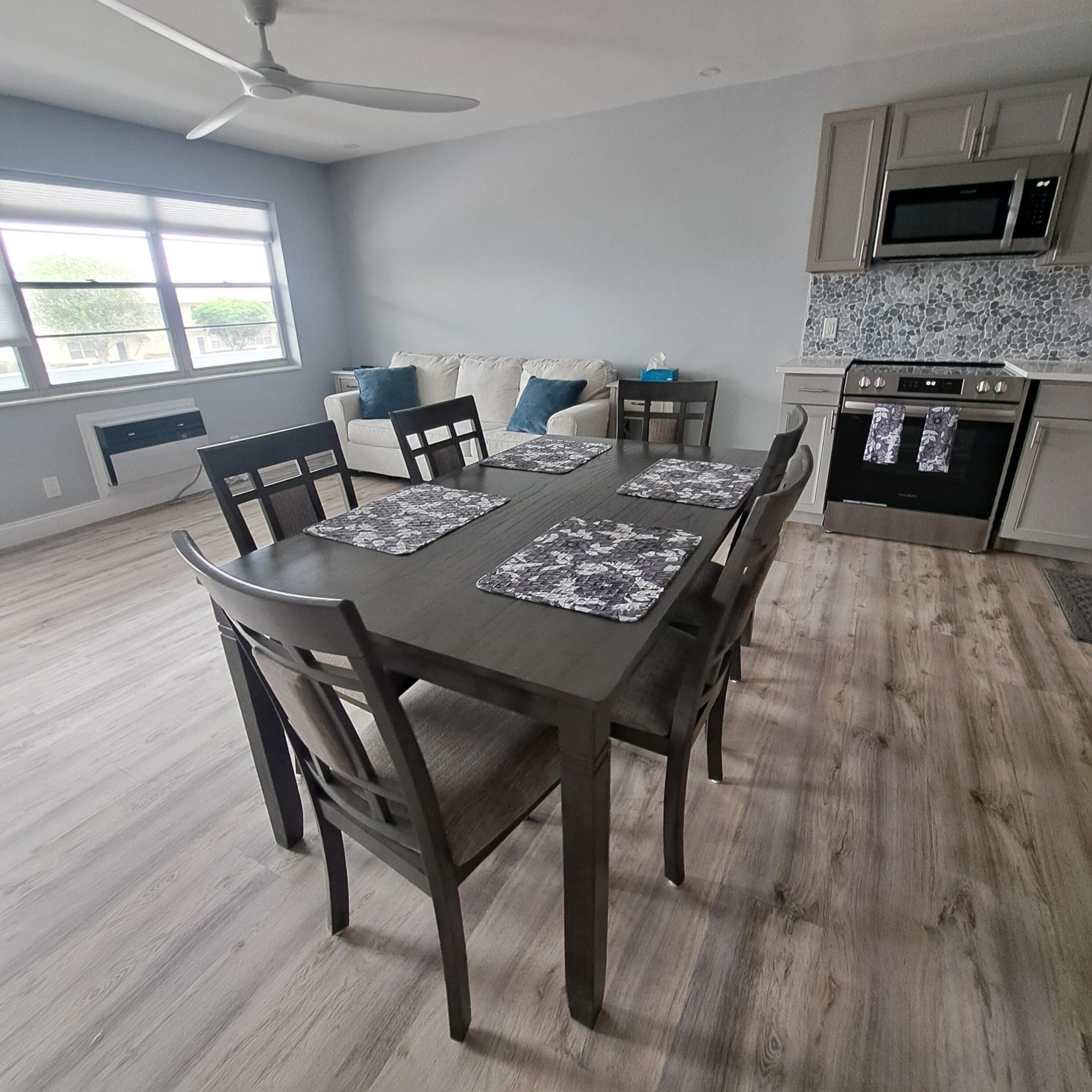55 Northampton C West Palm Beach, FL 33417 - Photo 8 of 14 a view of a dining room with furniture