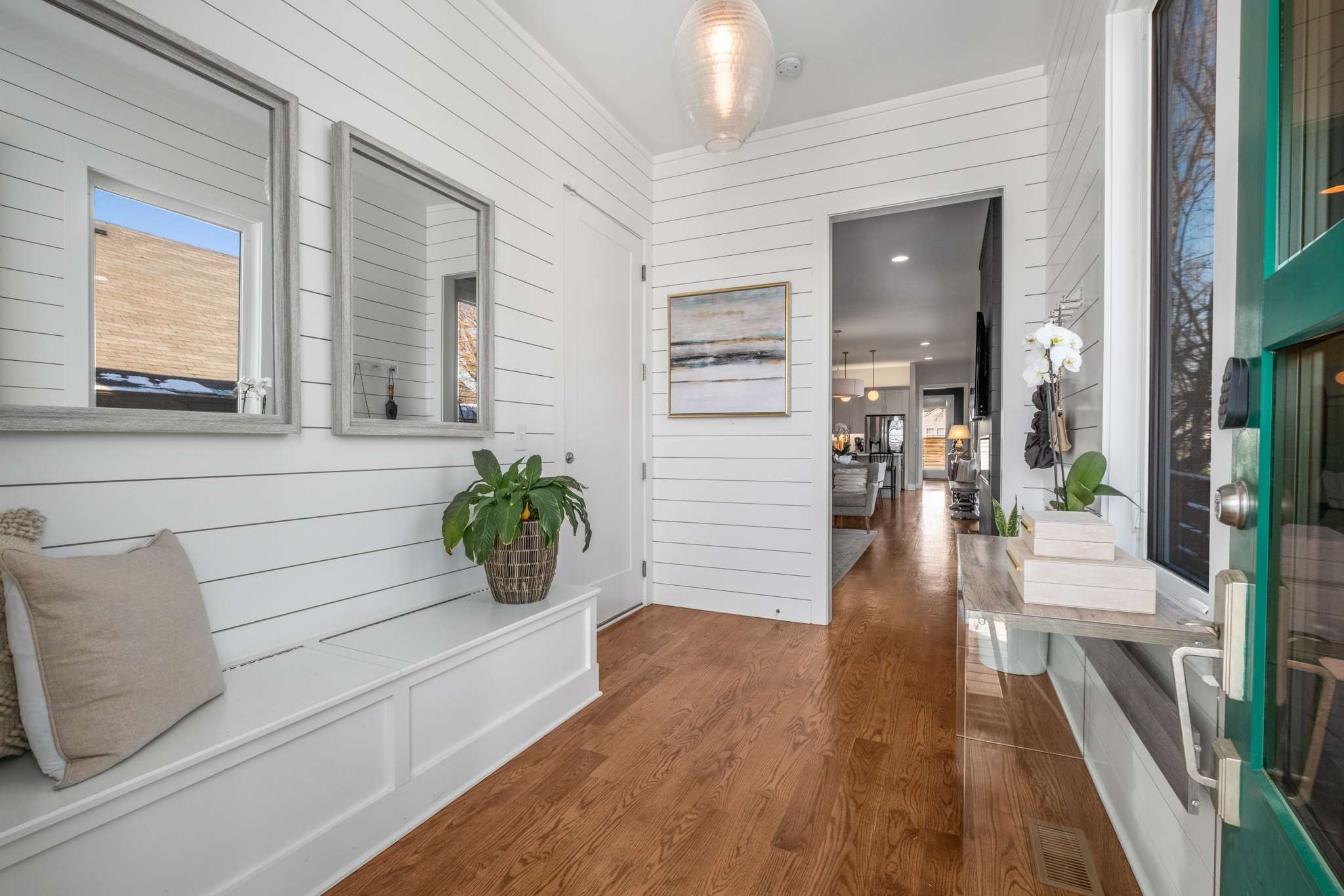 a view of an entryway and wooden floor