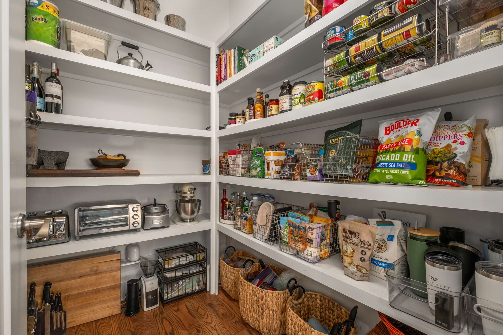 115 Rains Avenue, Unit A Nashville, TN 37203 - Photo 18 of 46 a cabinet with wine and lots of clutter on the wall