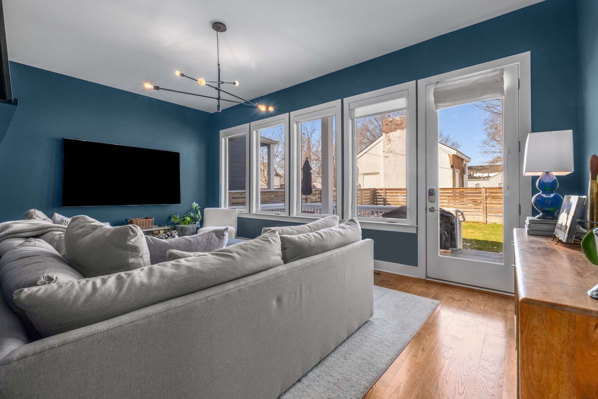 115 Rains Avenue, Unit A Nashville, TN 37203 - Photo 20 of 46 a living room with furniture and a flat screen tv