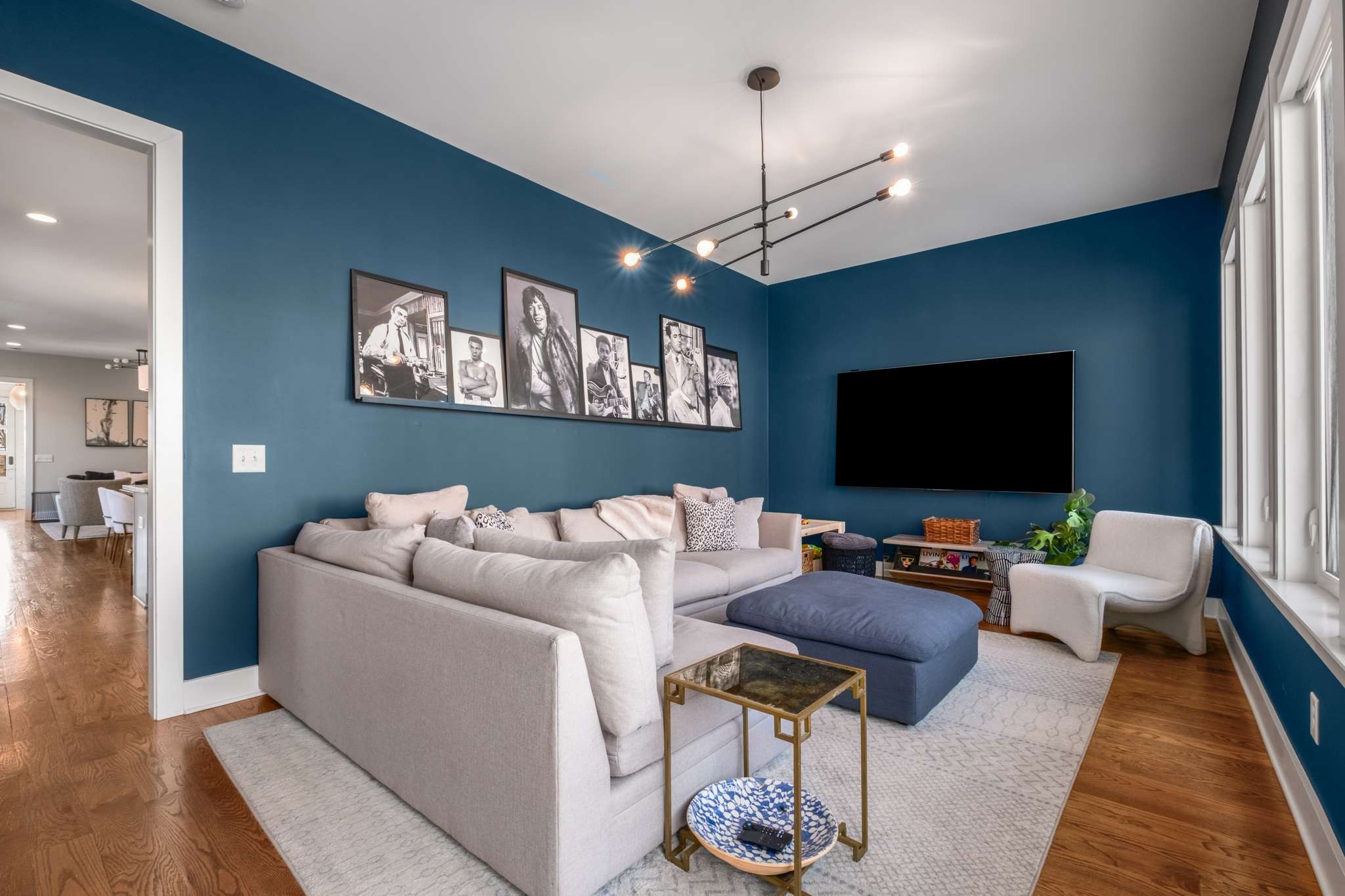 115 Rains Avenue, Unit A Nashville, TN 37203 - Photo 21 of 46 a living room with furniture and a flat screen tv